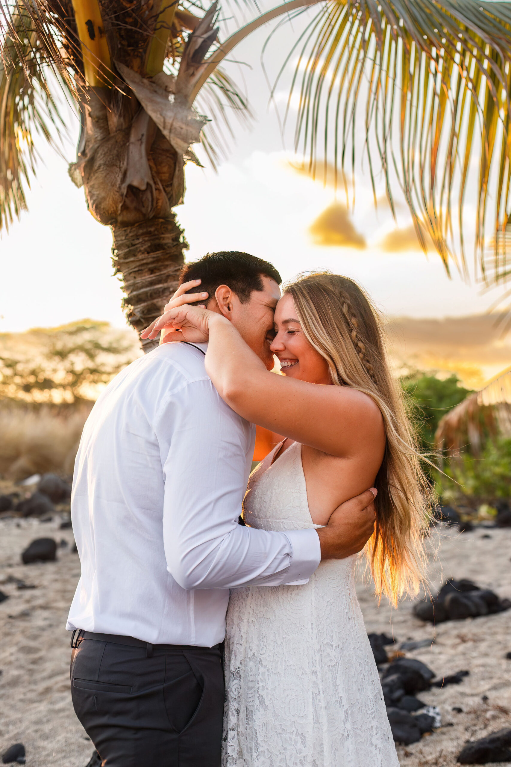 a couple laughing together as they embrace 