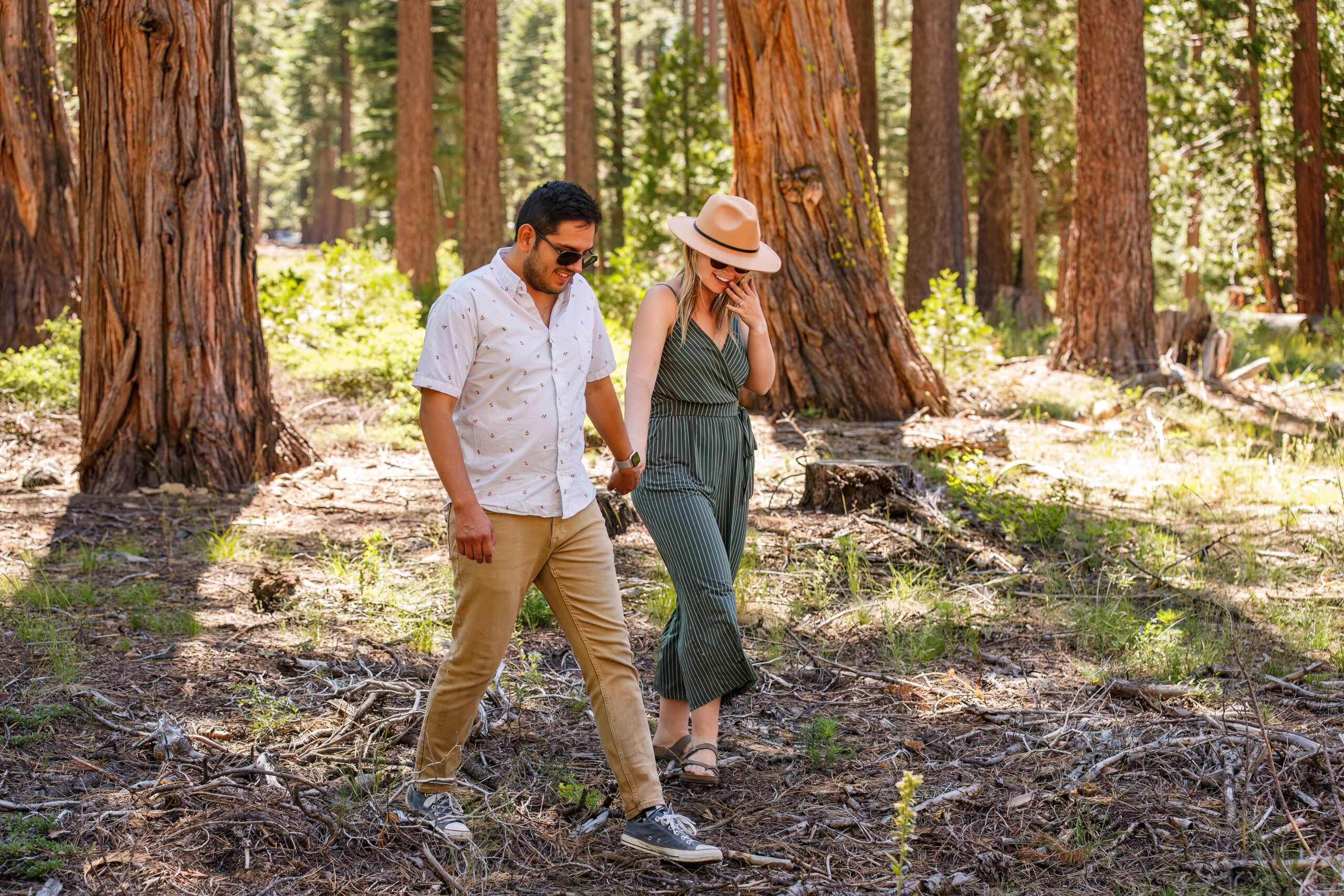 newly engaged couple exploring Lake Tahoe's trails for their engagement photos