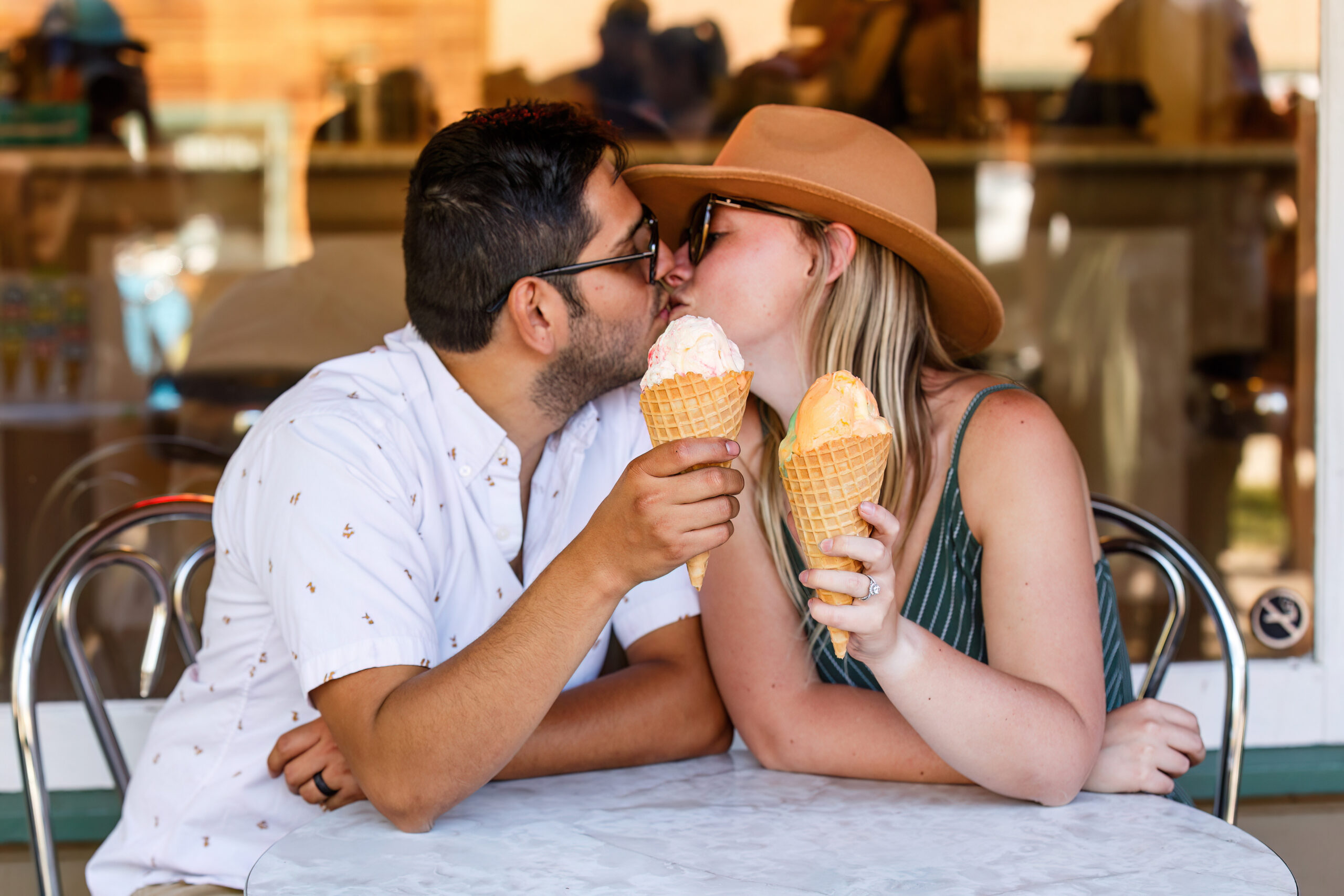 a couple kissing as they enjoy some ice cream during their Lake Tahoe engagement photos