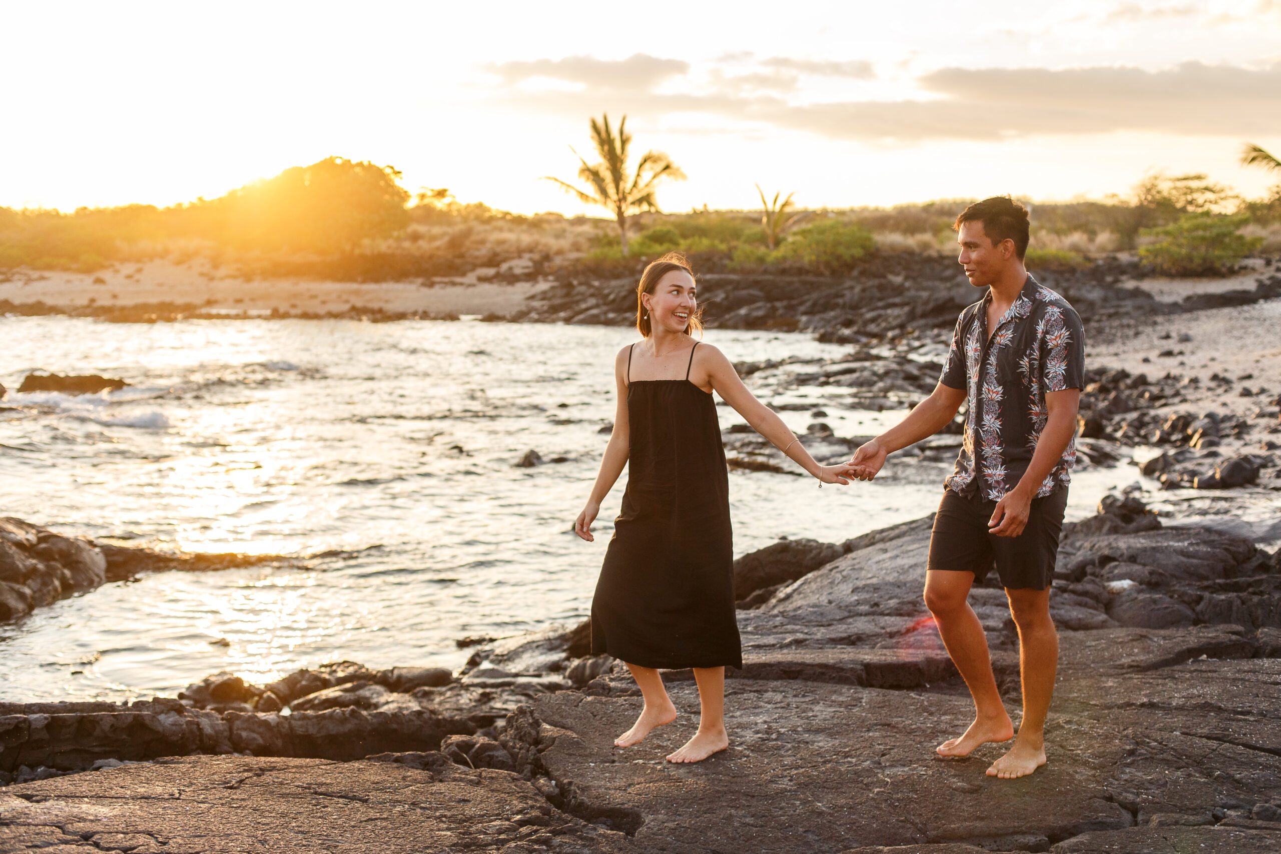 a couple walking on the beach together during their Hawaiian elopement
