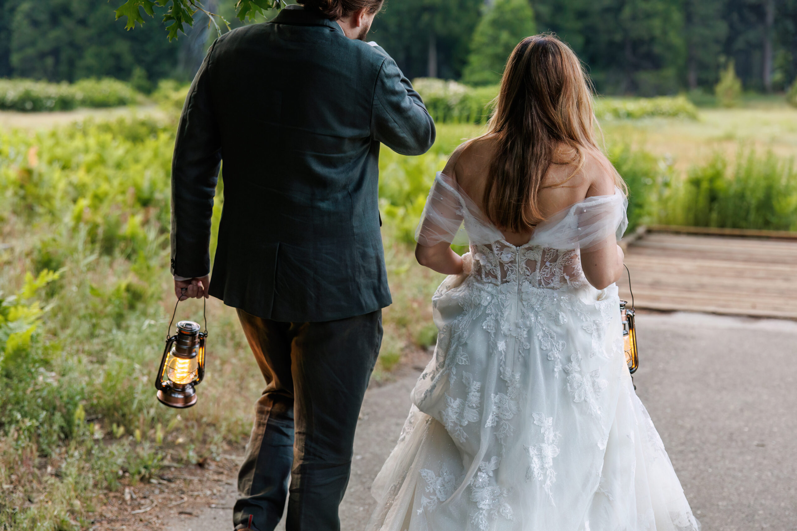 a couple walking down a trail together during their adventurous after session