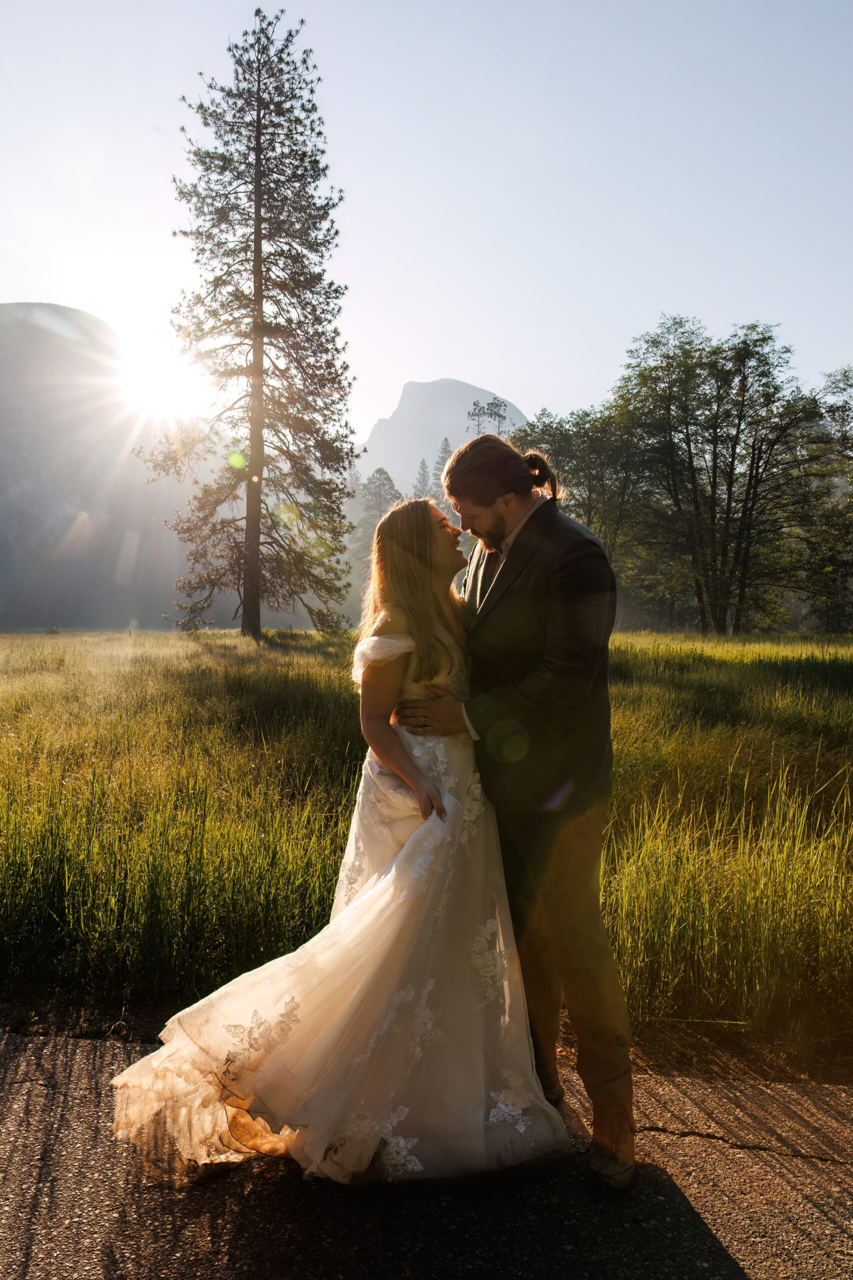 the couple about to kiss as the sun is beaming on them