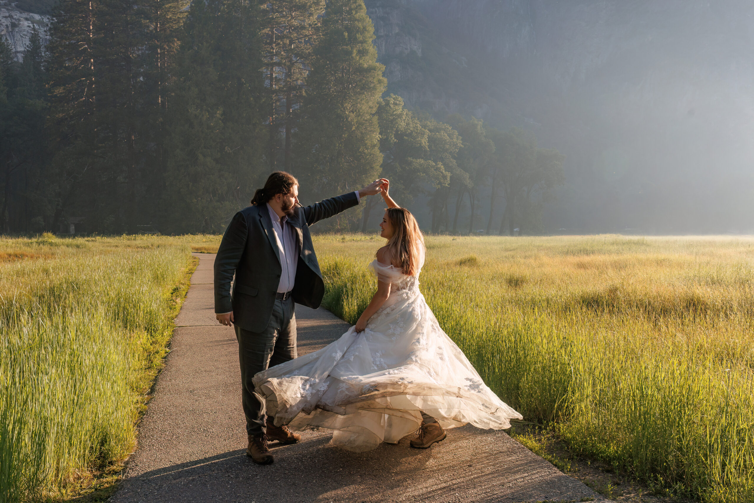 newly weds dancing in a valley in Yosemite