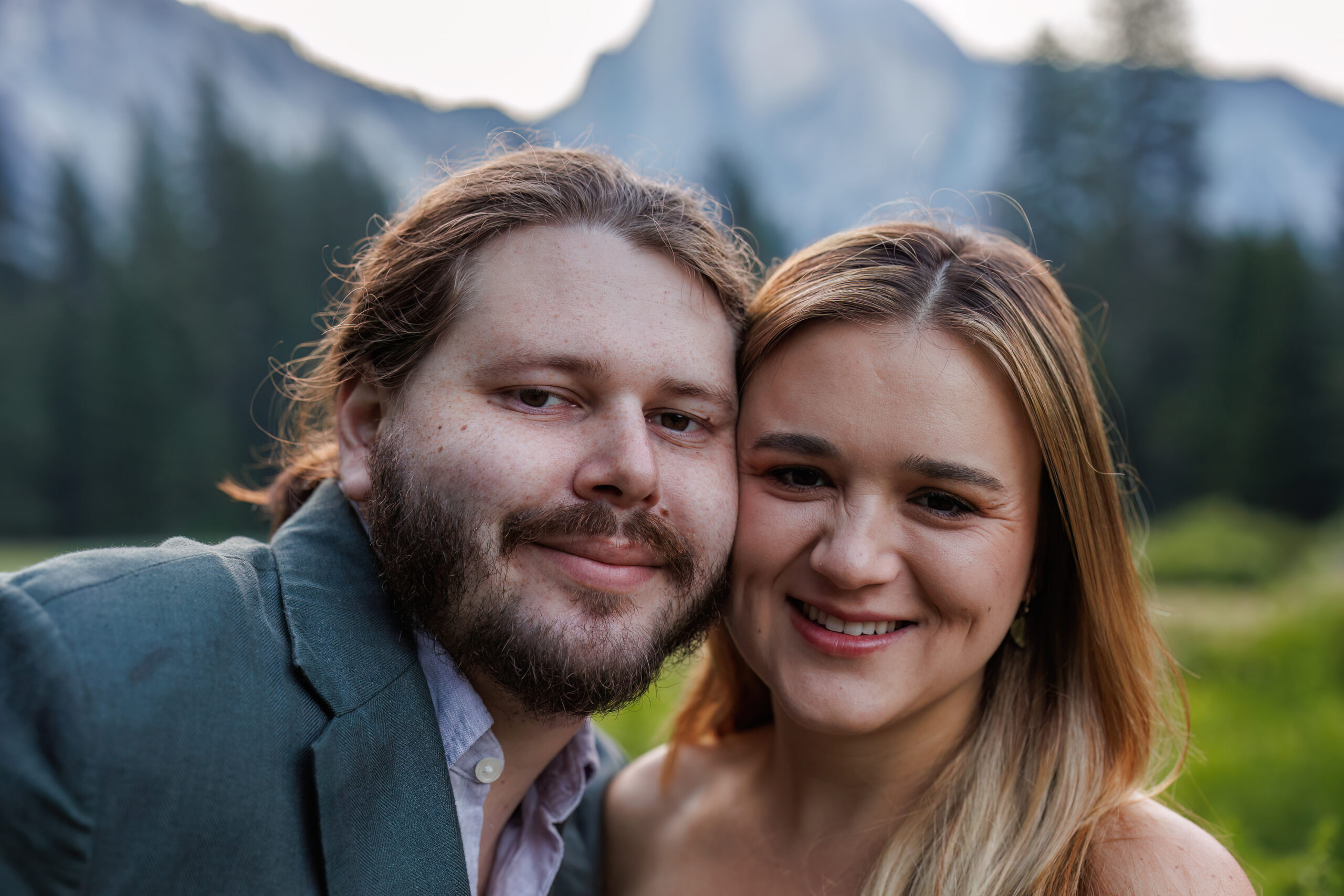 newly weds smiling at the camera during their adventurous after session