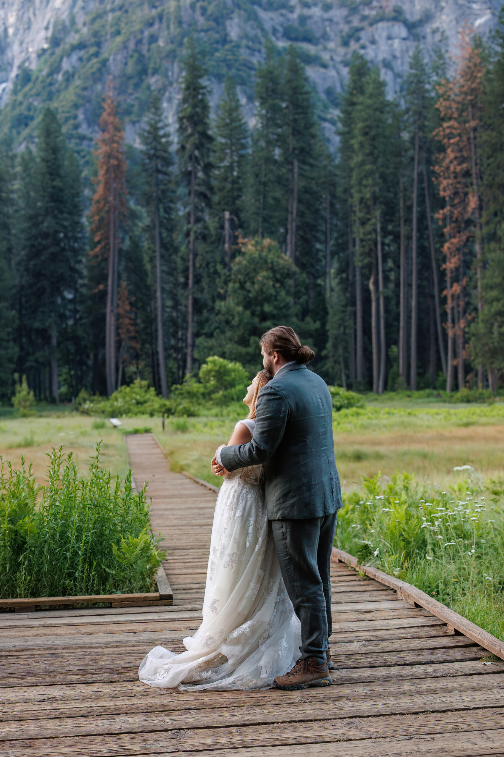 a couple watching the sunrise during Yosemite wedding photos