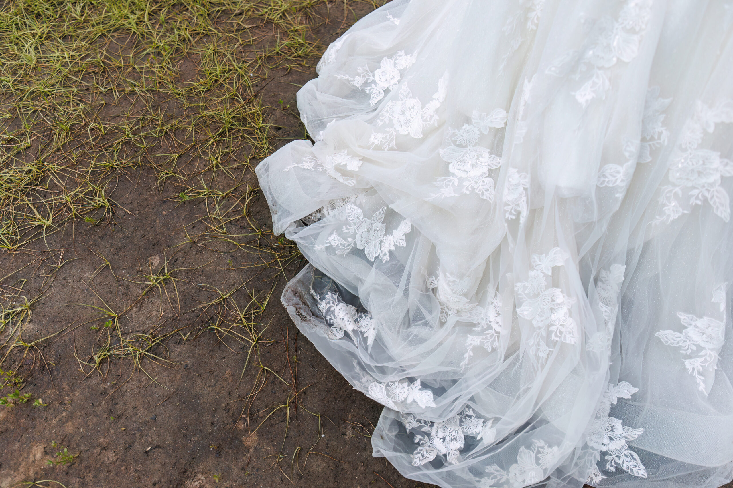 the brides dress on the ground