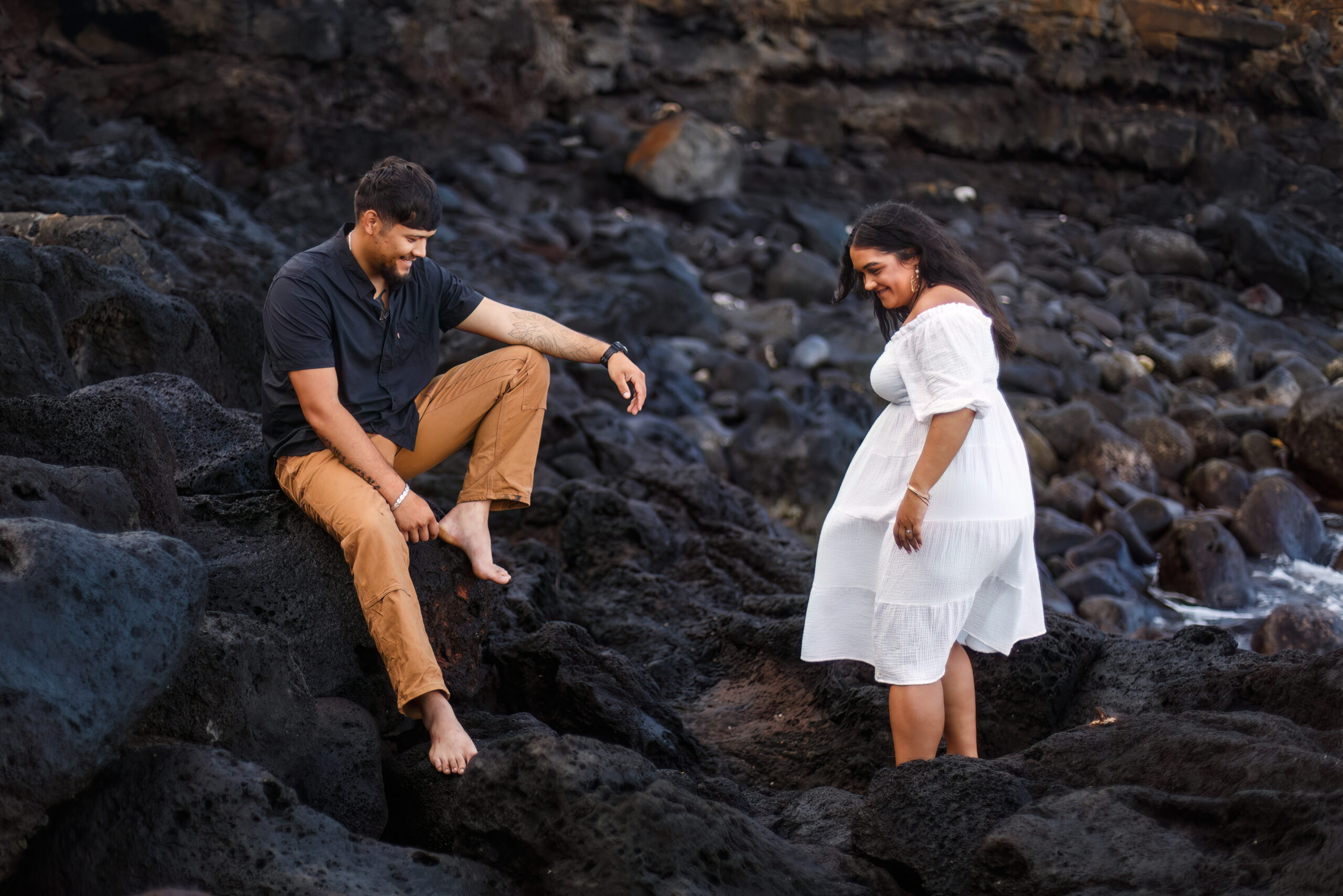 a couple exploring the lava rocks together