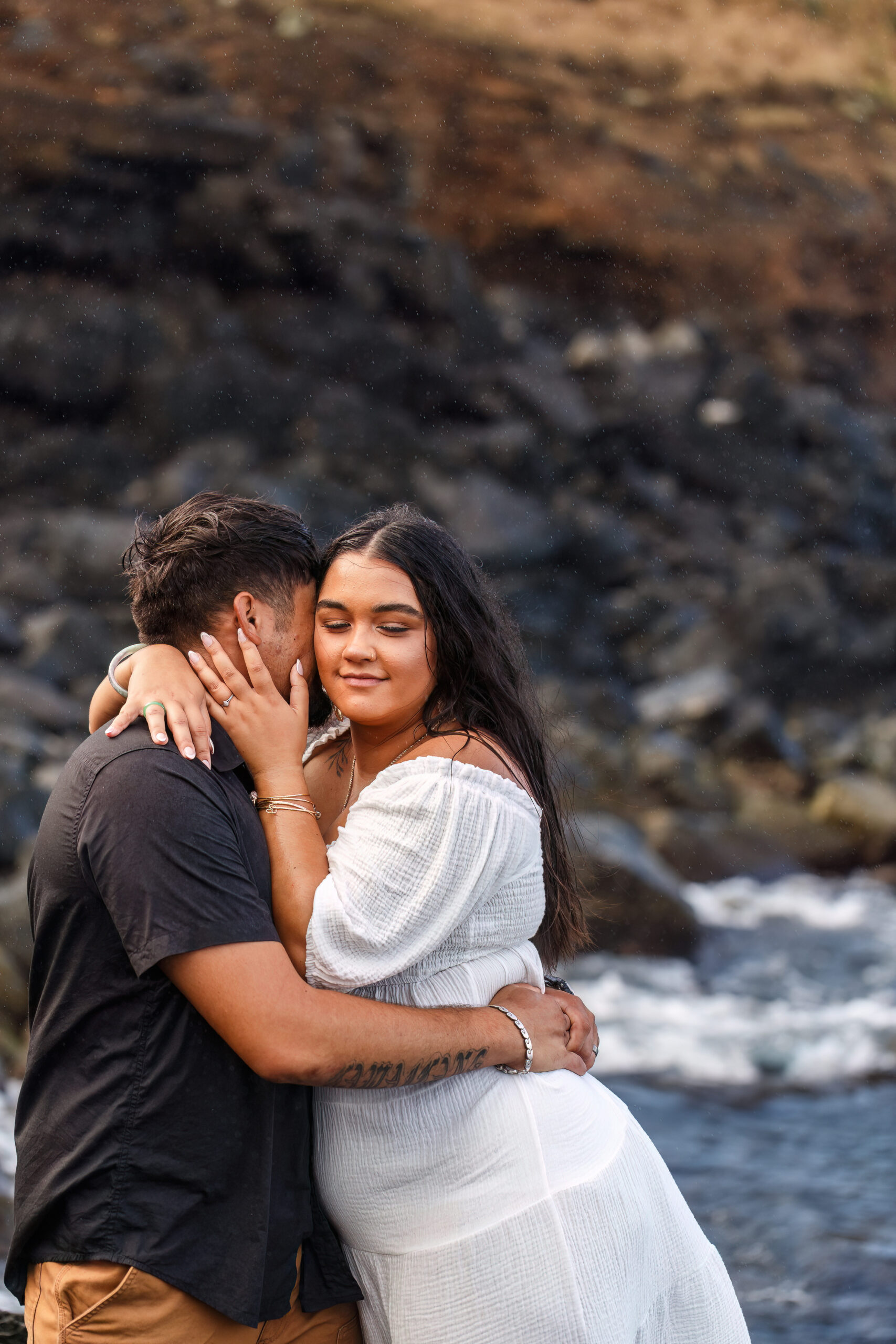 a man kissing a woman's cheek