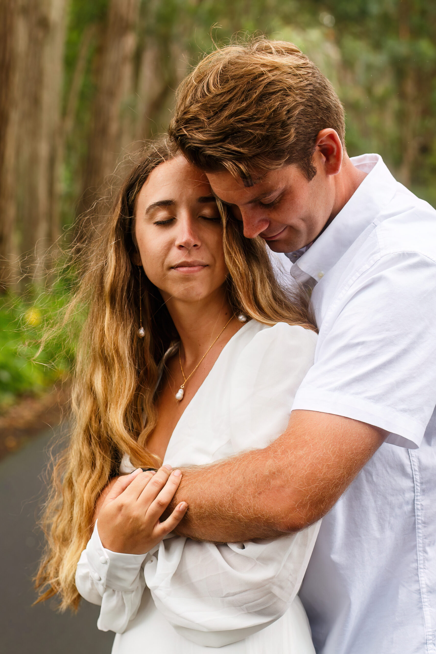 a man holding a woman from behind
