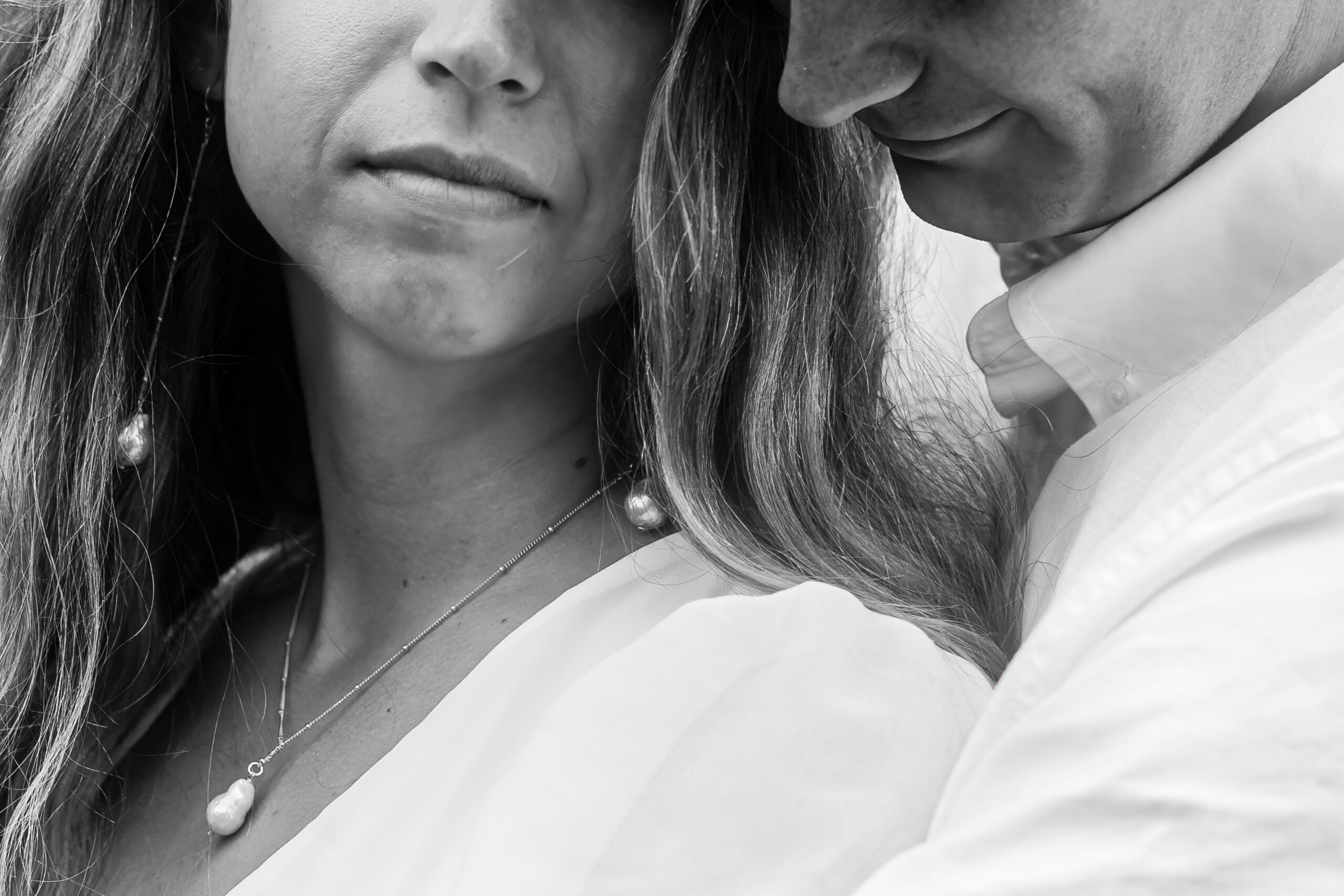 close up of a couple's faces as they cuddle into each other