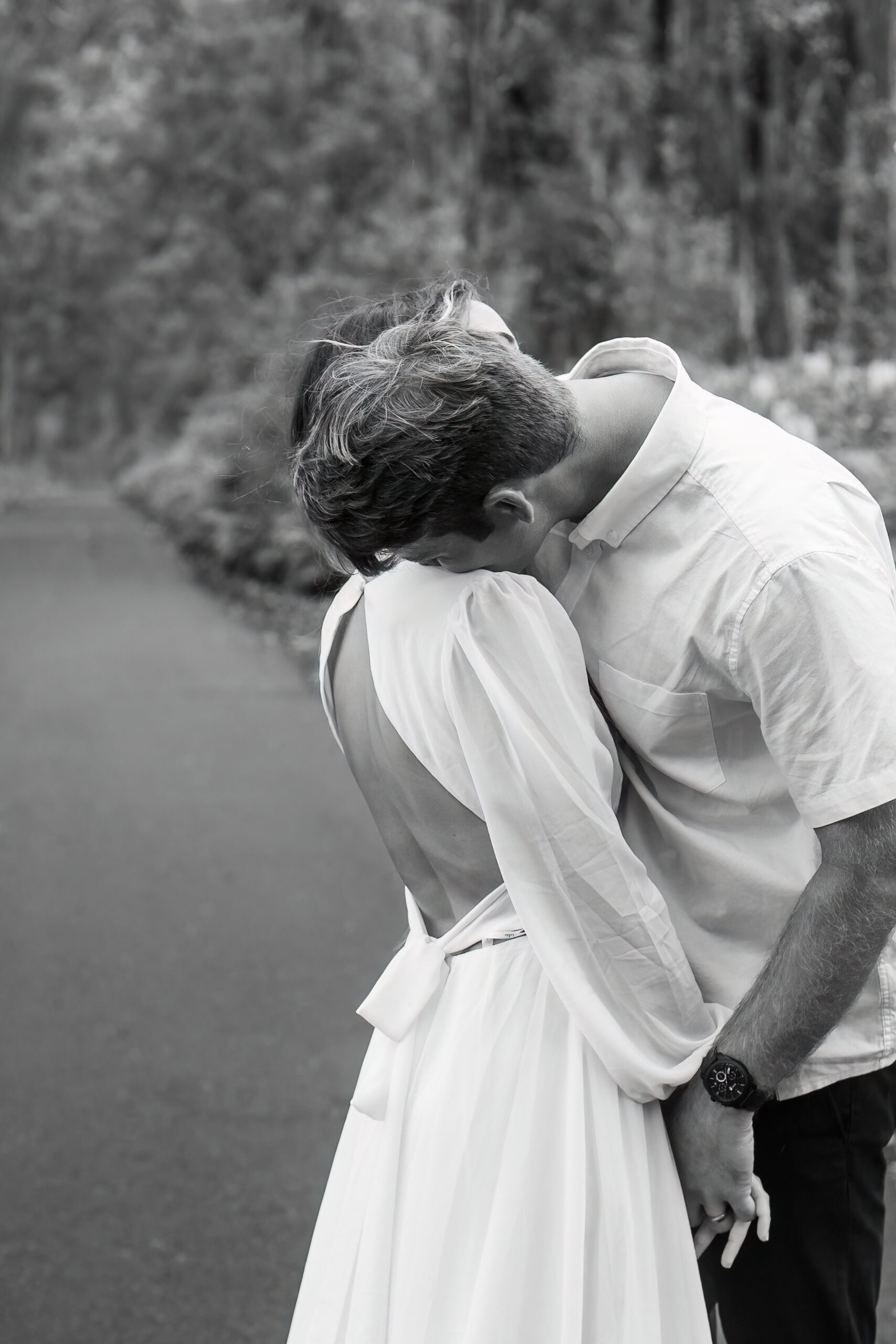a man kissing a woman's shoulder during their Hawaiian elopement