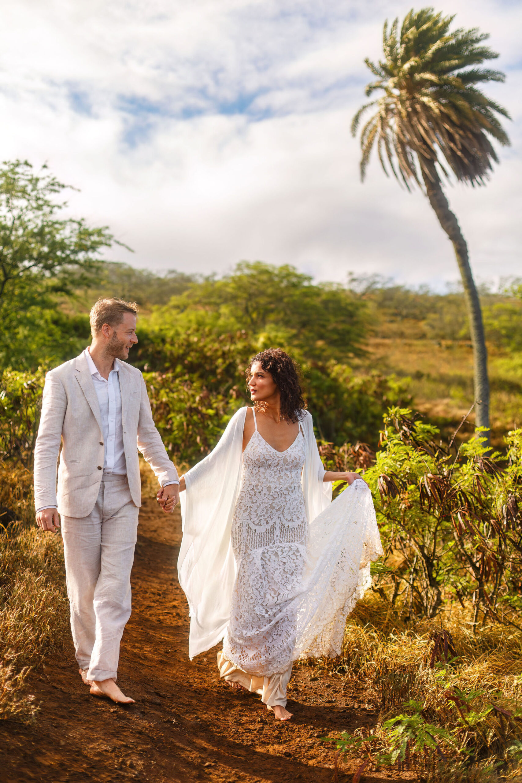 a couple walking on a path together in Hawaii