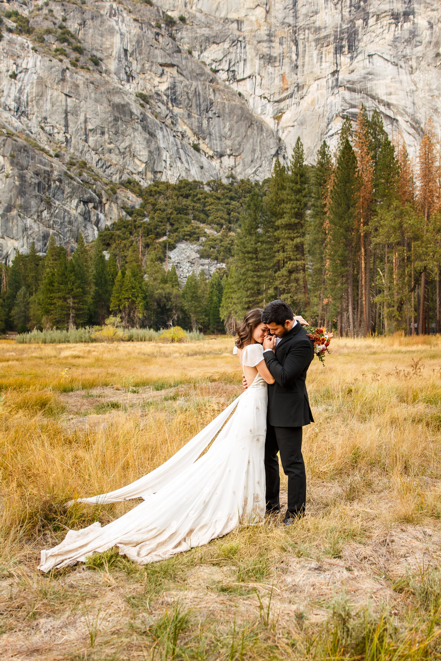 newly weds spending time in a meadow in Yosemite