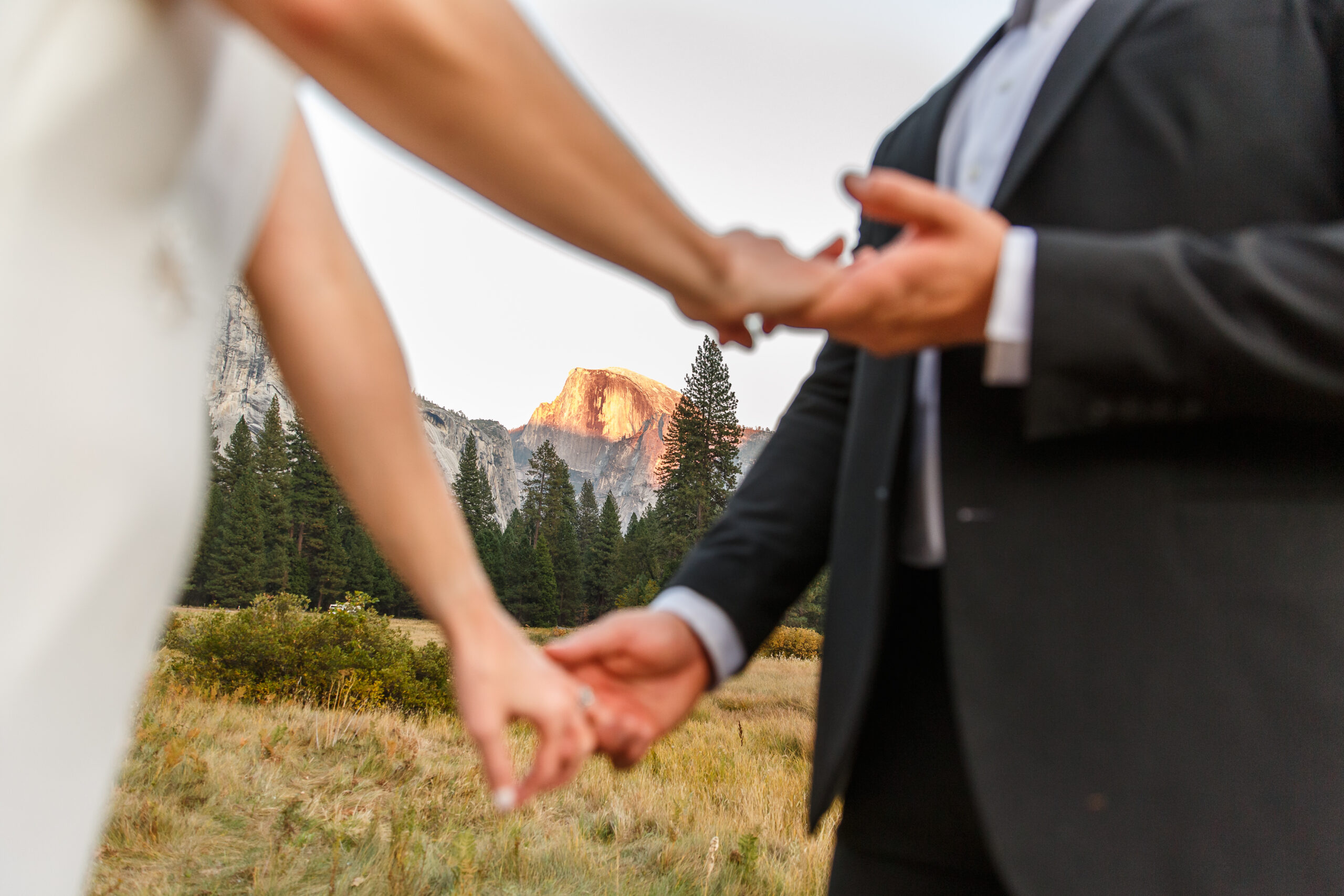 a couple holding hands in Yosemite