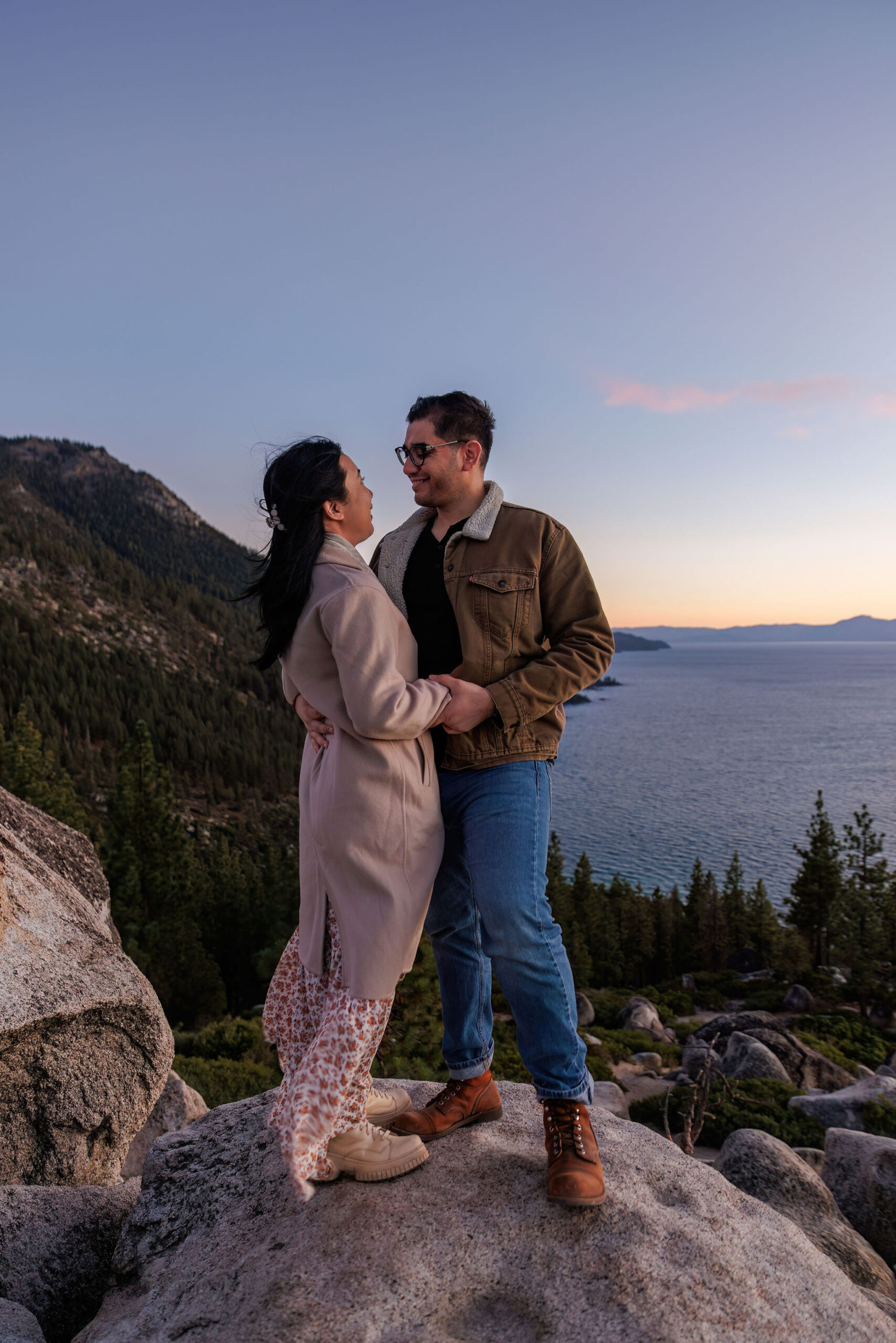 newly weds holding and smiling at each other during their adventure elopement