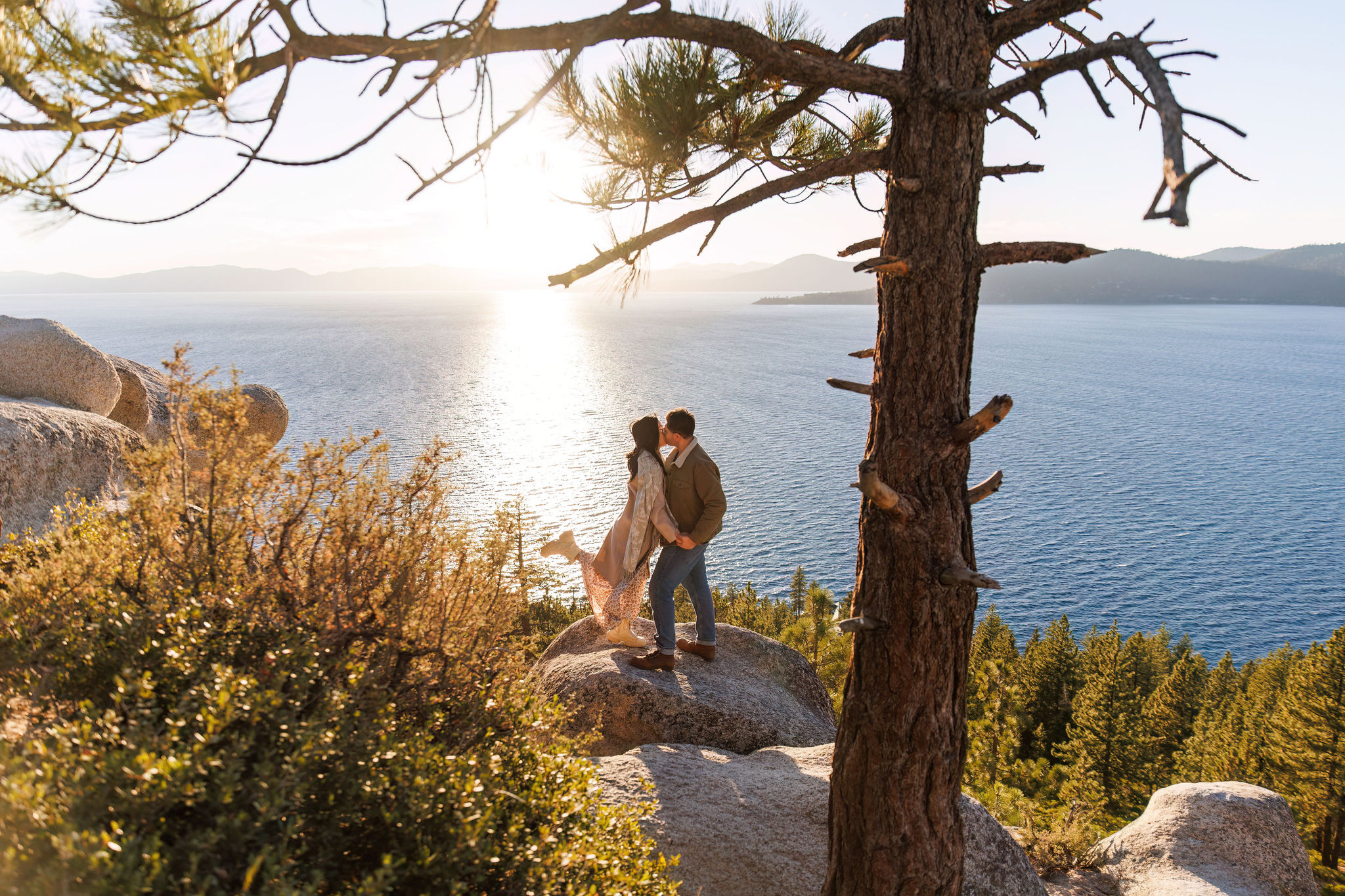 newly weds kissing with Lake Tahoe behind them