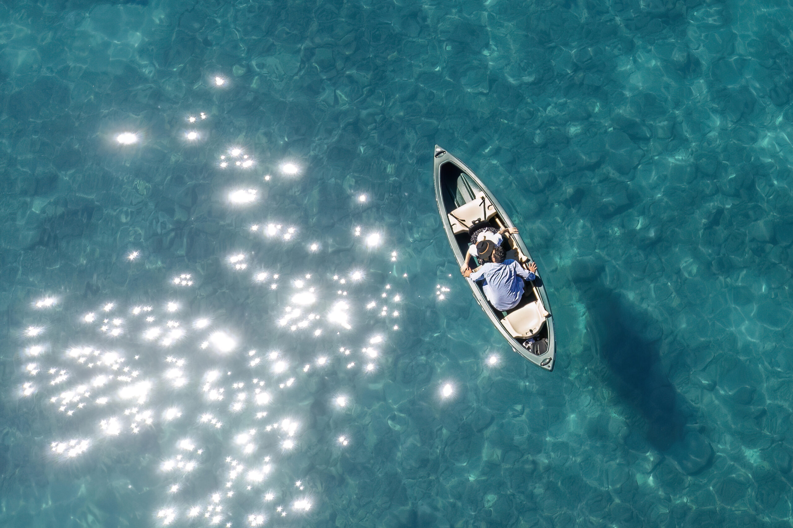 a couple kissing in a canoe in Lake Tahoe
