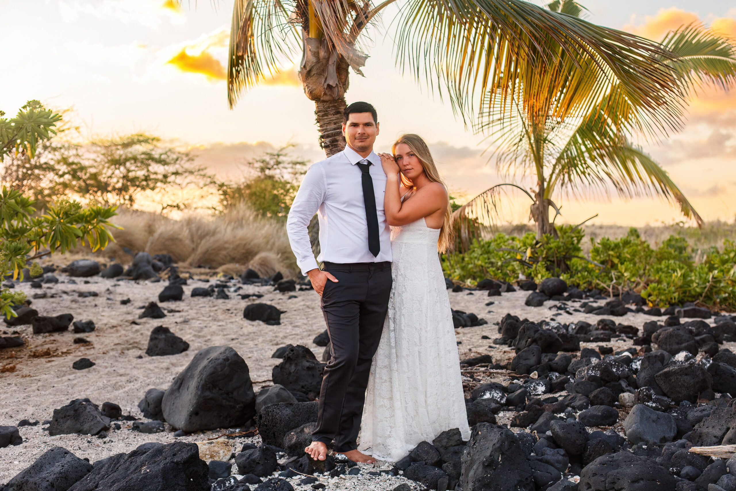 newly weds on a Hawaiian beach during their elopement timeline