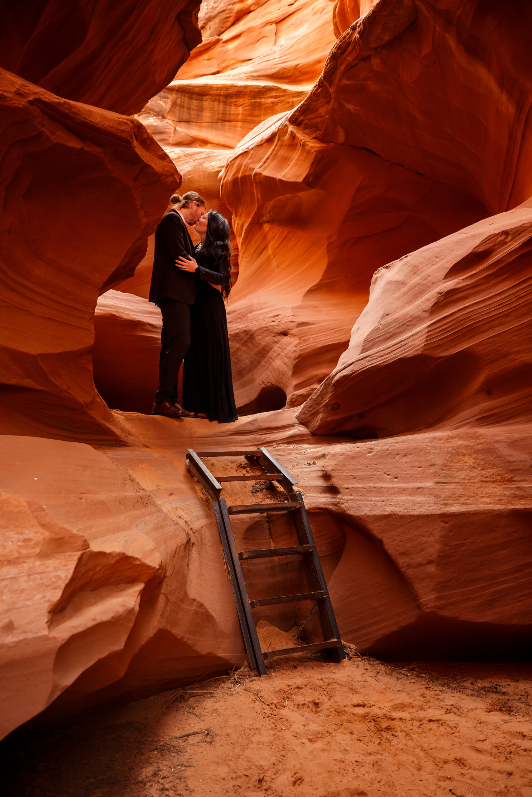 a couple making time for cool portraits in the slot canyons during their elopement timeline