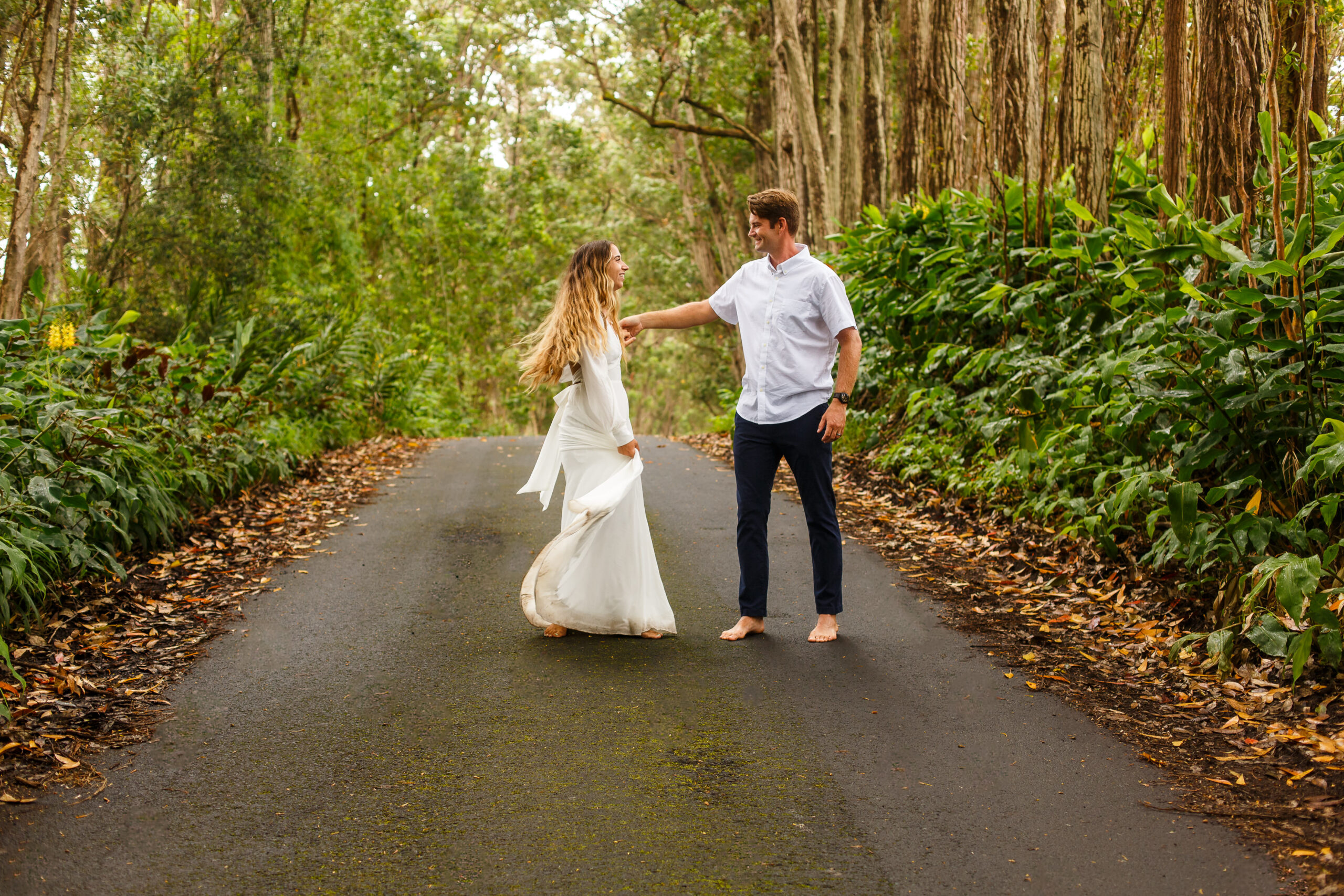 newly weds dancing on a path together during their elopement