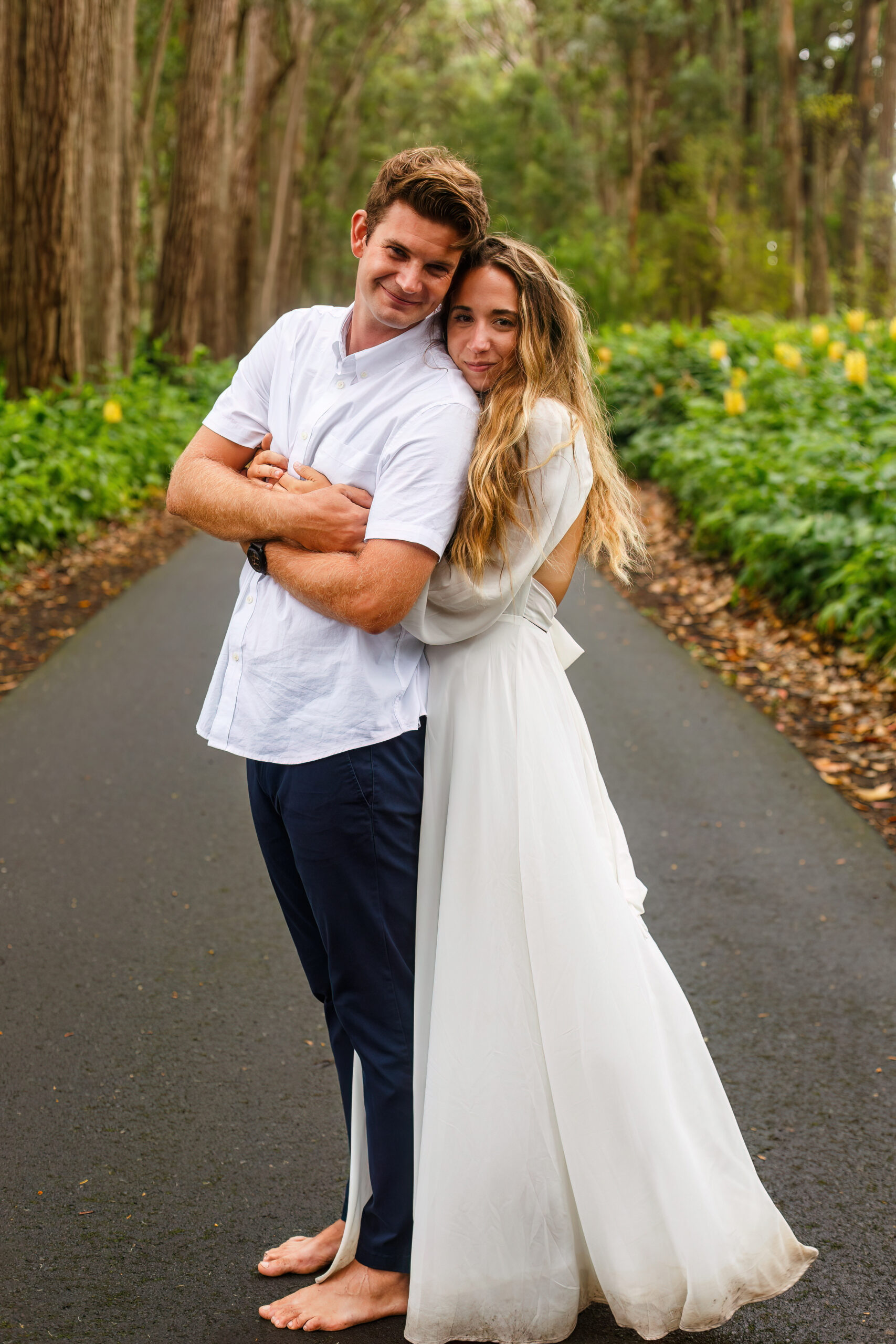 a woman holding a man from behind during their elopement