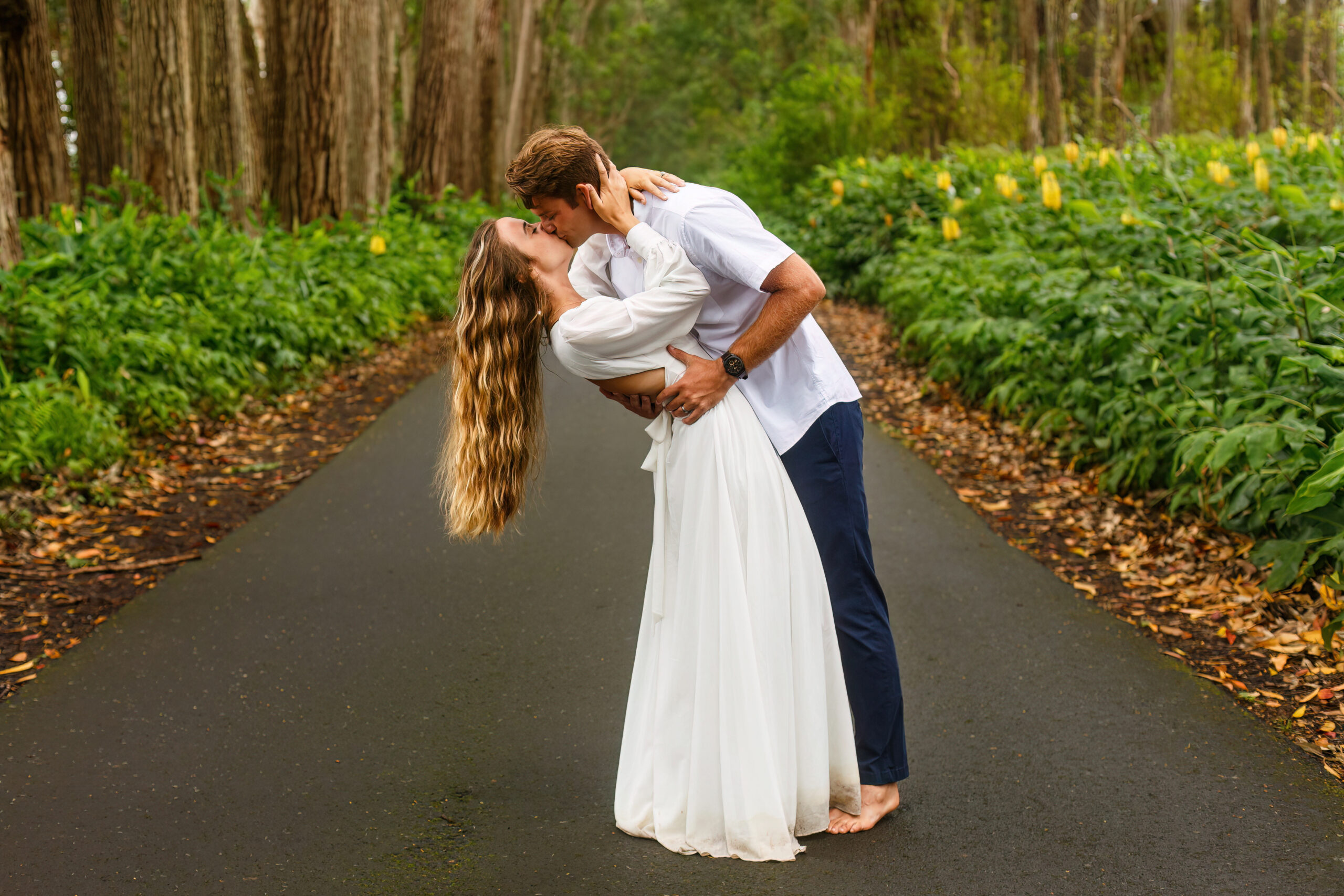 a man dipping and kissing a woman on their wedding day