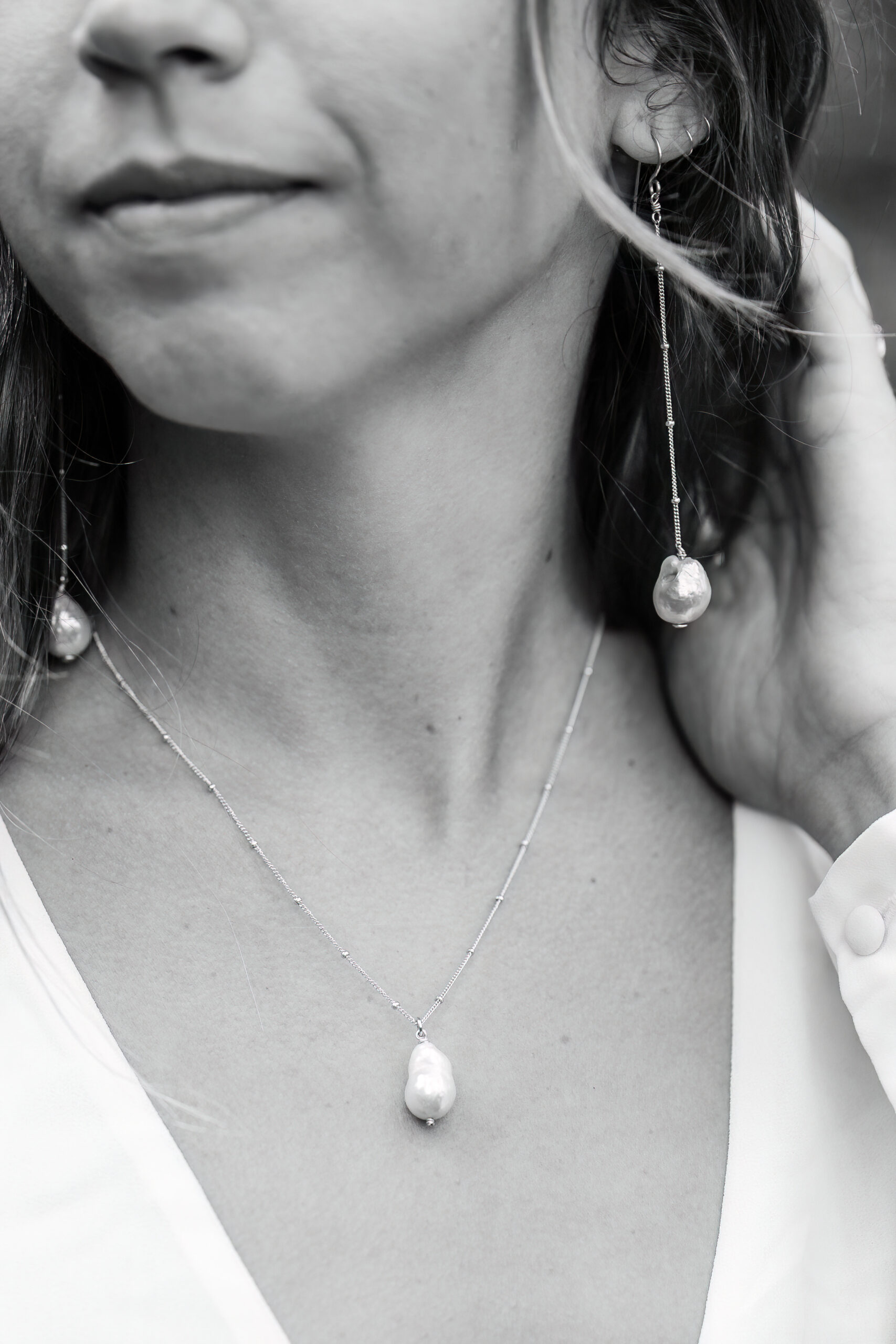 a bride's earrings and necklace