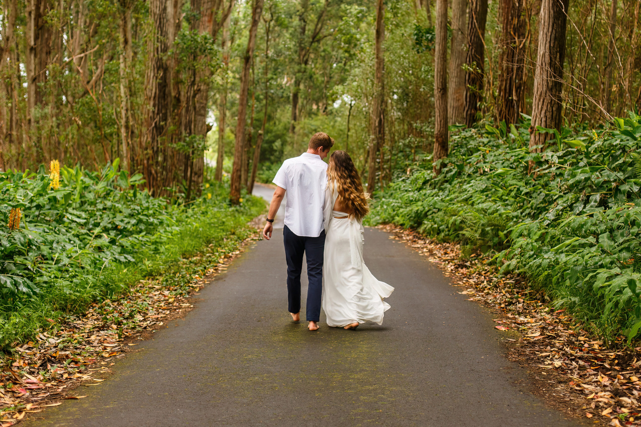 a couple walking down a path together on their elopement day