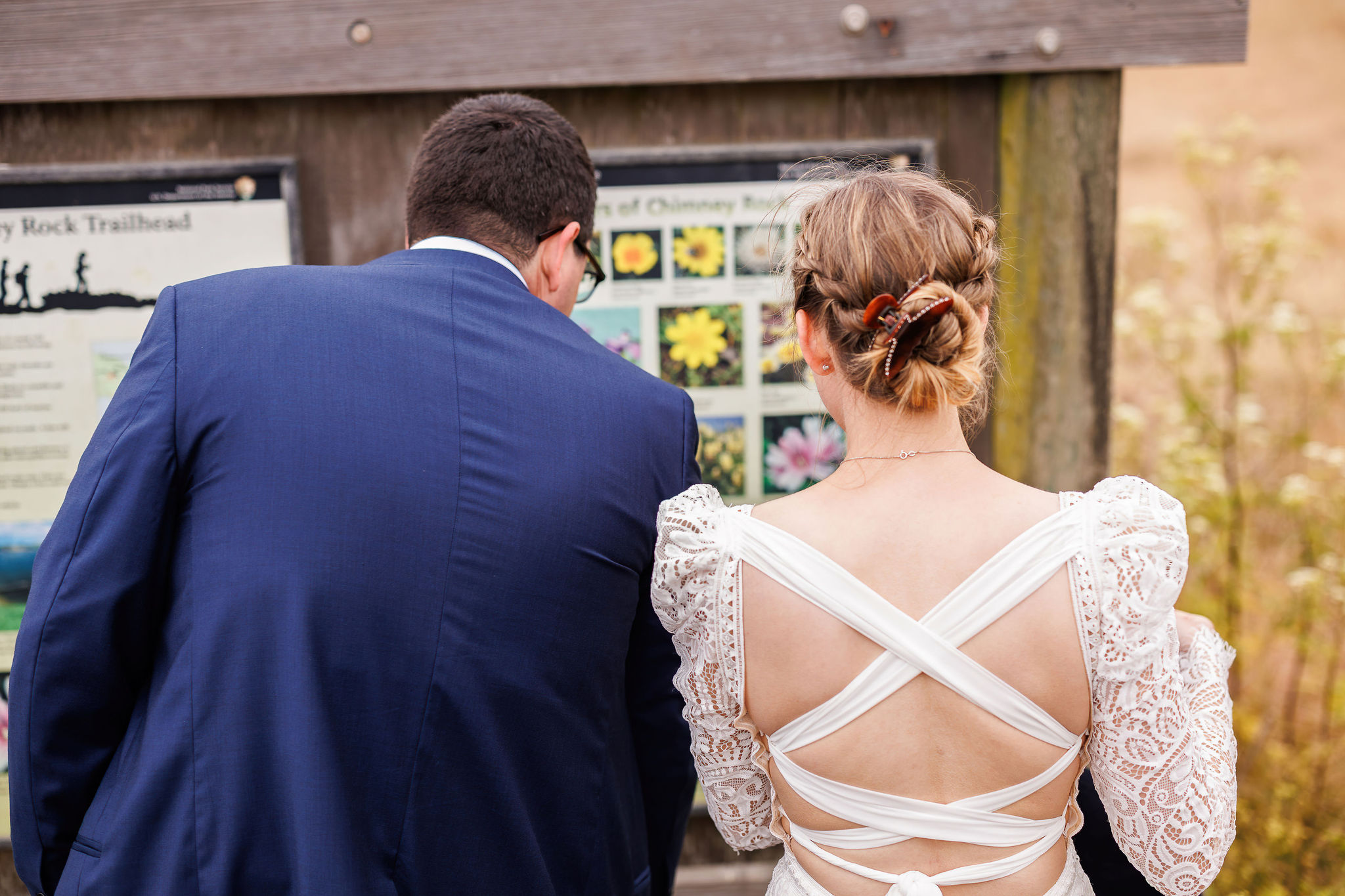newly weds looking at the trail maps during their Point Reyes elopement