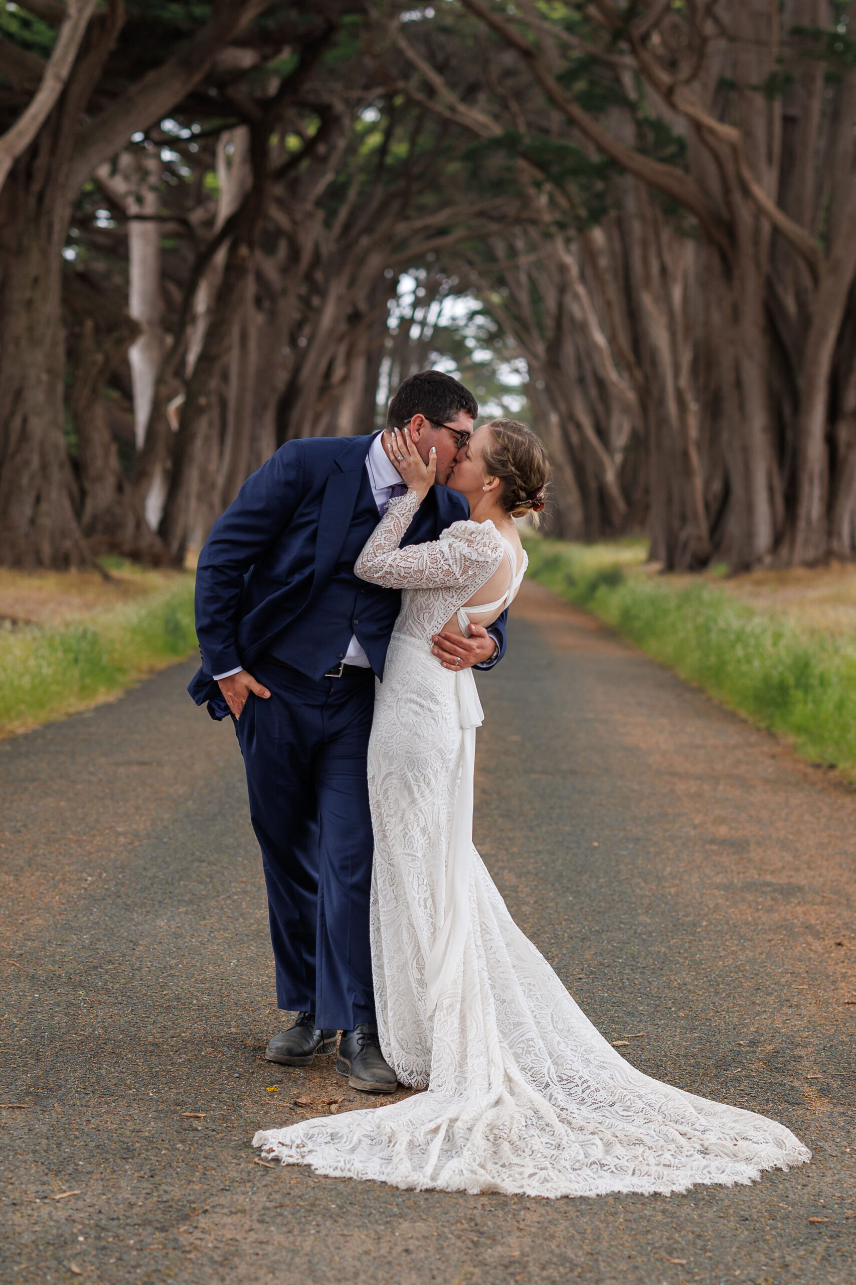 a couple kissing under the canopy of trees during their Point Reyes elopement